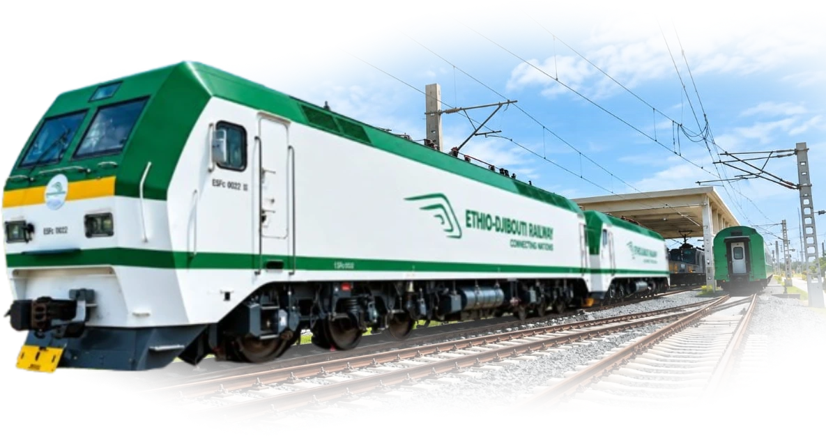 An Ethio-Djibouti Railway electric locomotive in the green and white livery, at the head of its train under the overhead line